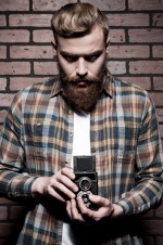 hipster man with old camera